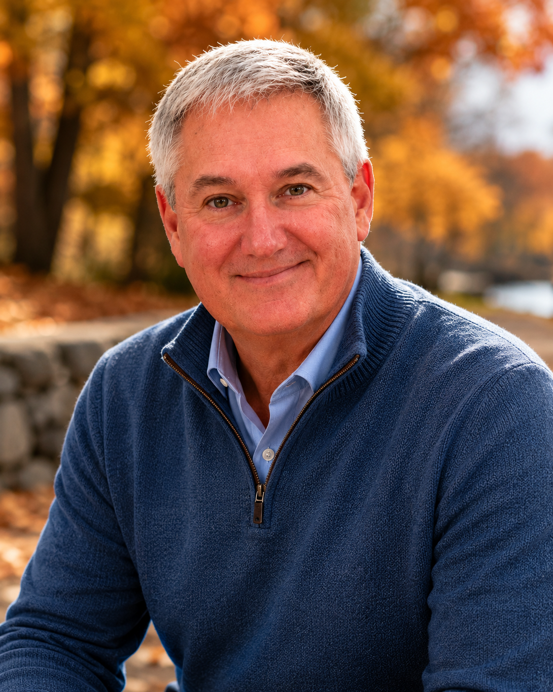 Portrait of author John Pizarro outdoors among autumn foliage